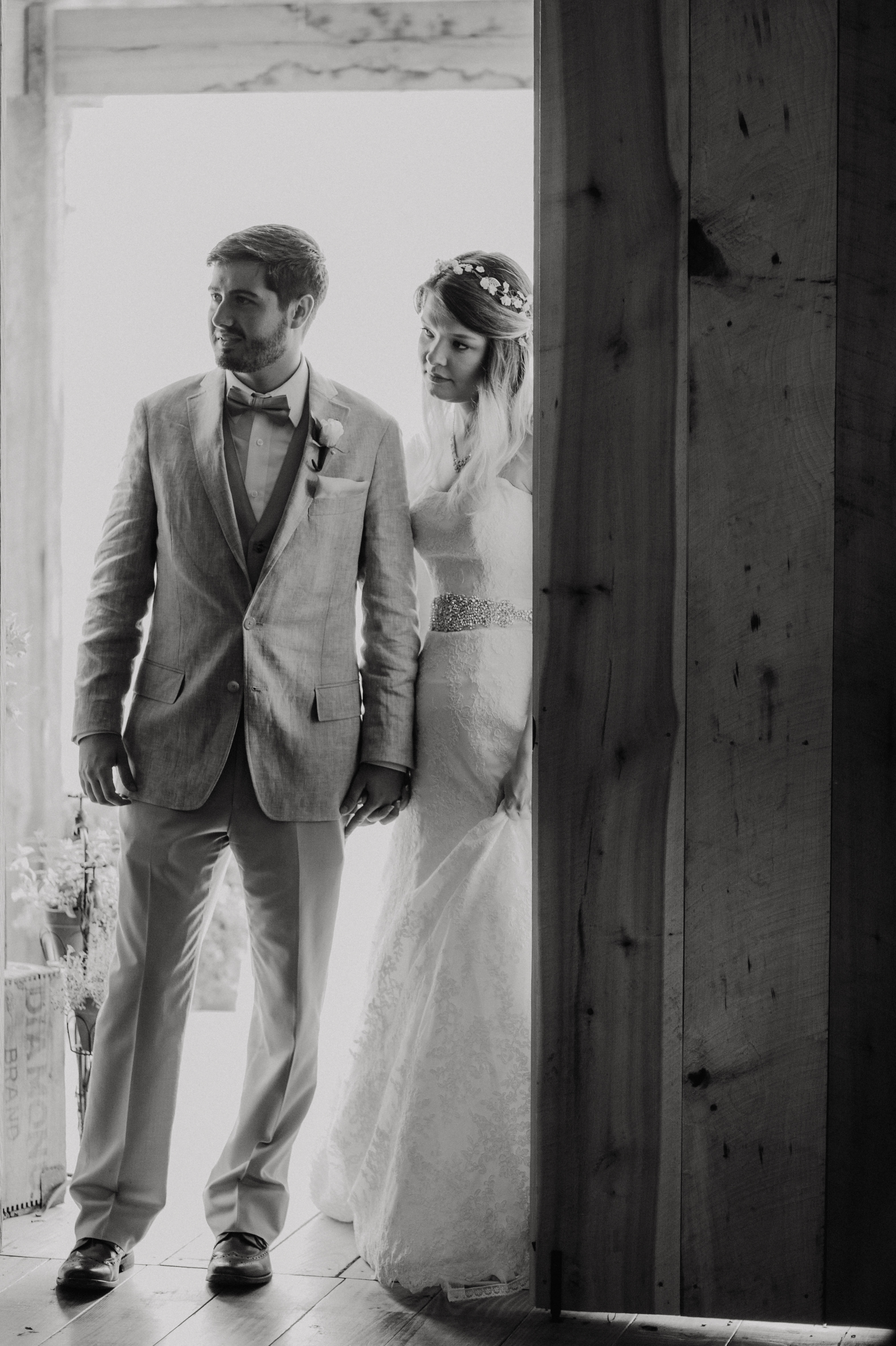 Aliyah Grace Burton Photography - The Bride and Groom peak into the Reception as they await their presentation as husband and wife at White Pine Grove