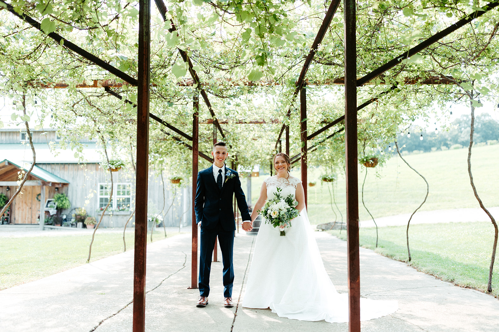 Jono Spear Photography - Bride and Groom under arbor at White Pine Grove