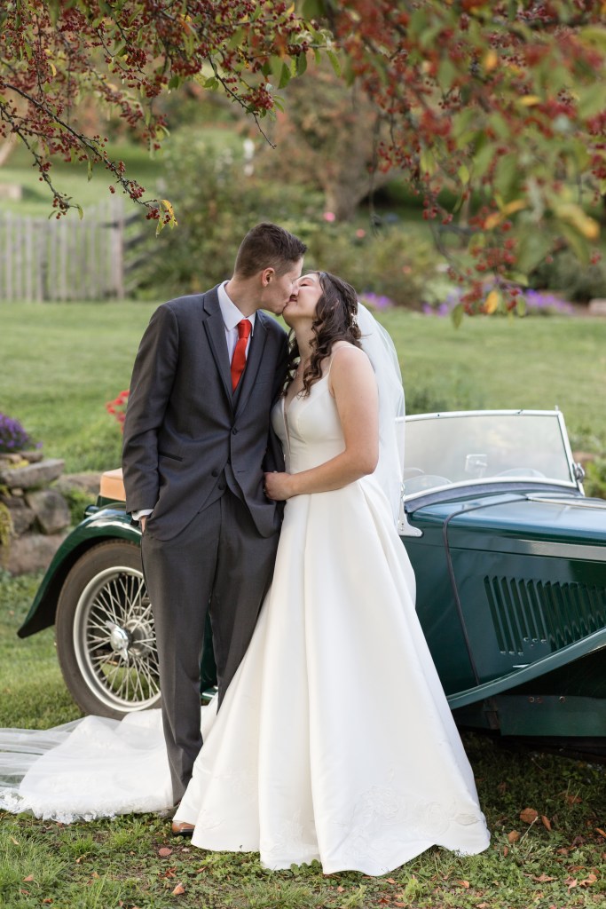 Mohican Media - Bride and Groom kiss with MG at White Pine Grove