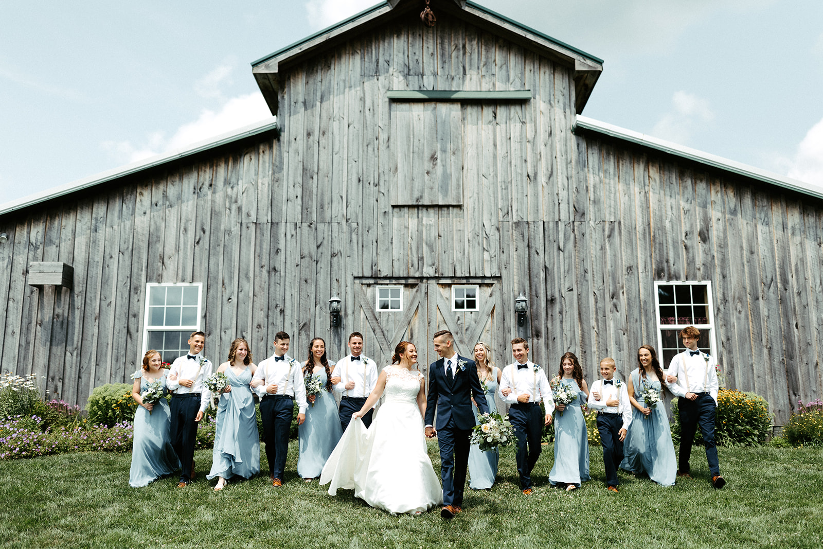Jono Spear Photography - Walking Wedding Party in front of barn at White Pine Grove