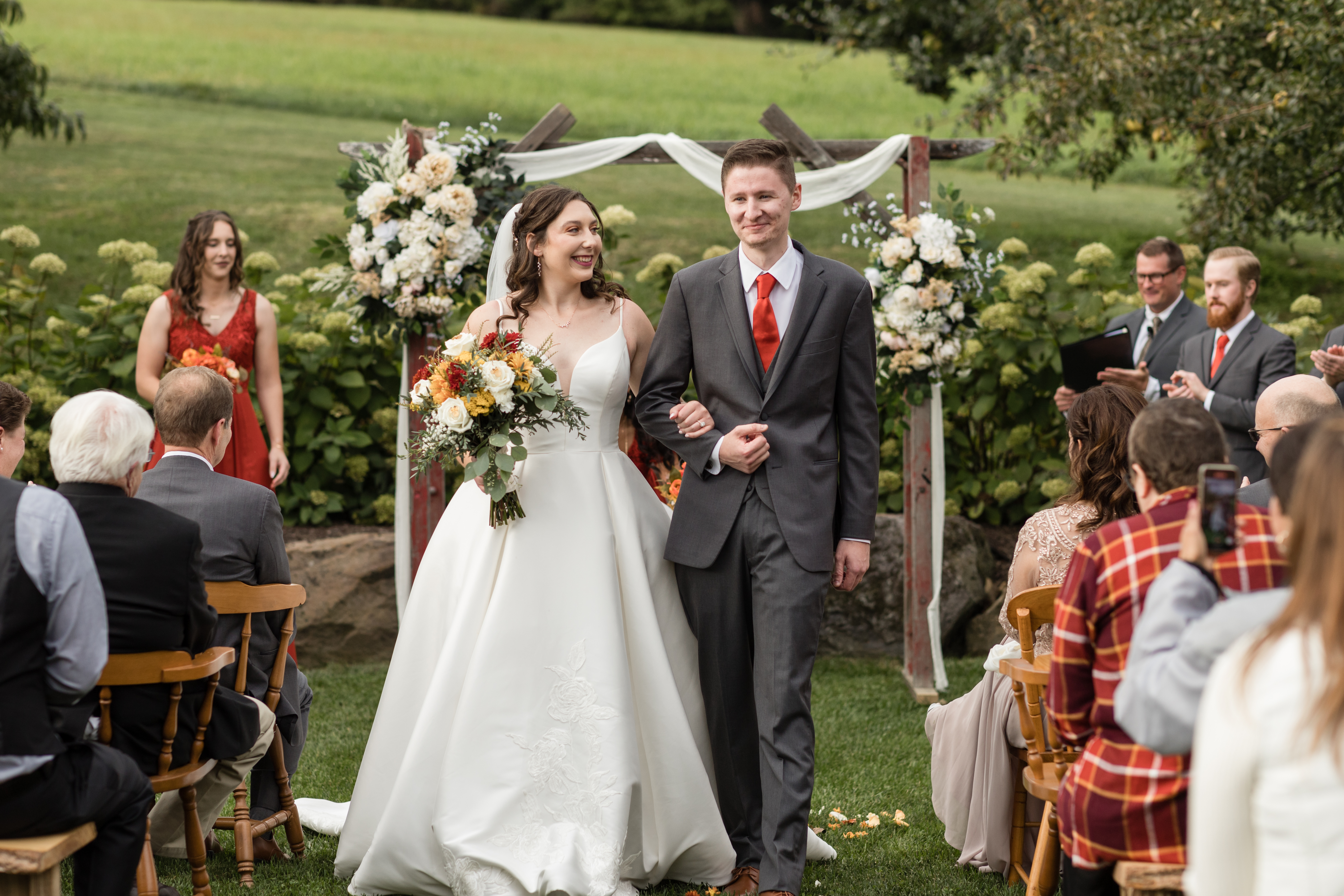 Mohican Media - Bride and Groom leaving Ceremony in Orchard at White Pine Grove