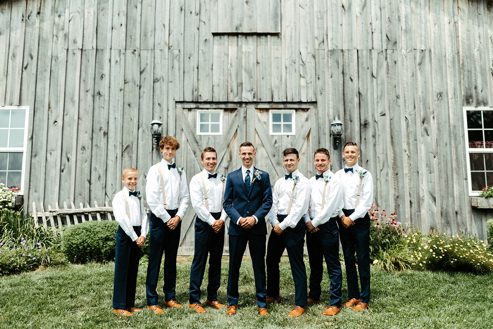 Jono Spear Photography - Groom and Groomsmen in front of barn at White Pine Grove